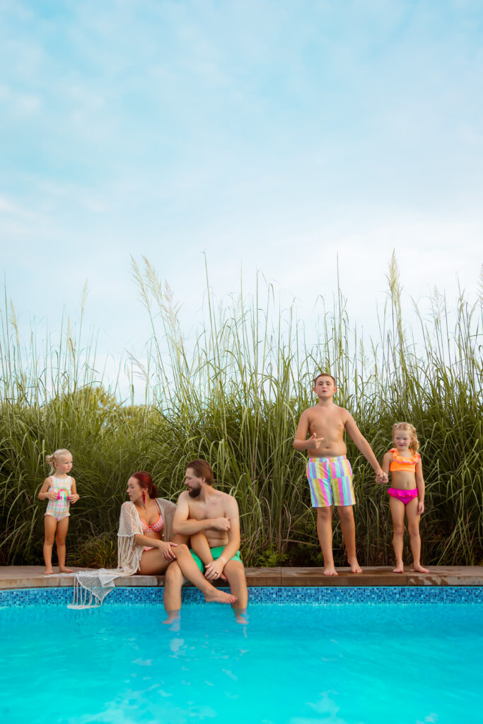 If you search Family Photos Near Me in Kansas City you'll find photographers that will photograph families in their own pool together to capture play and colorful fun pictures.