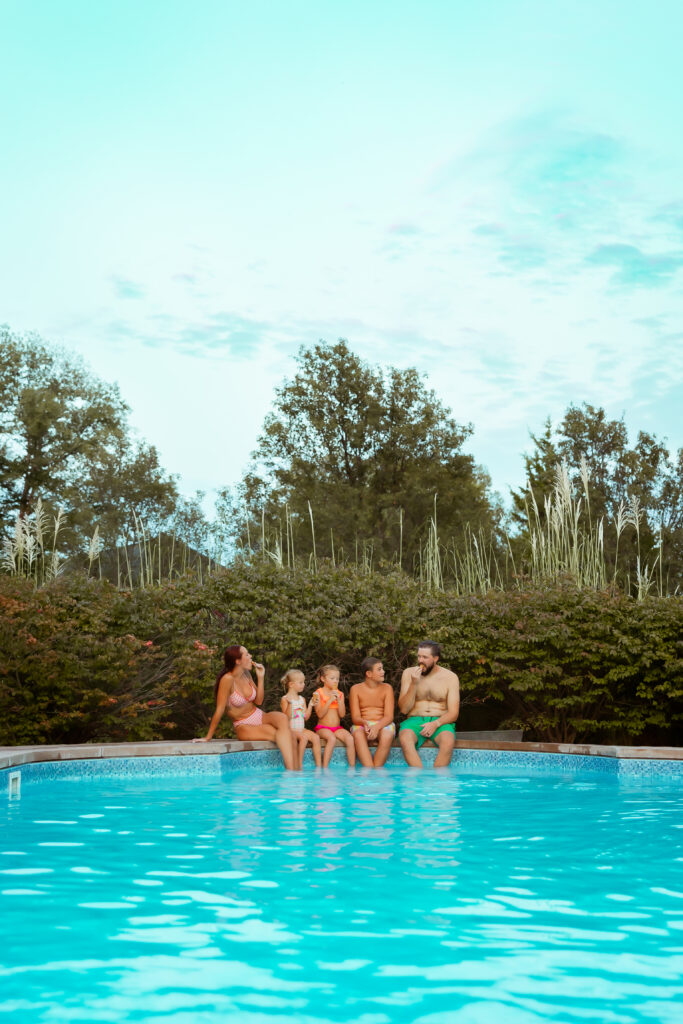 If you search Family Photos Near Me in Kansas City you'll find photographers that will come to your home and photograph you and your family at your home in your own swimming pool with your family.